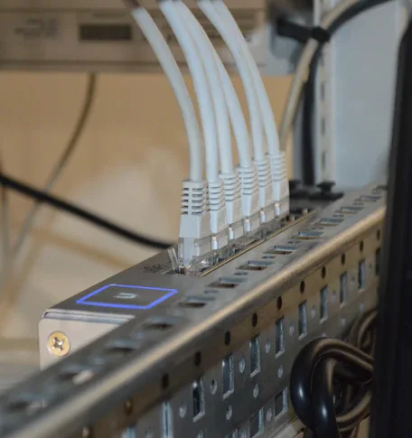 Network cables connected to communications equipment